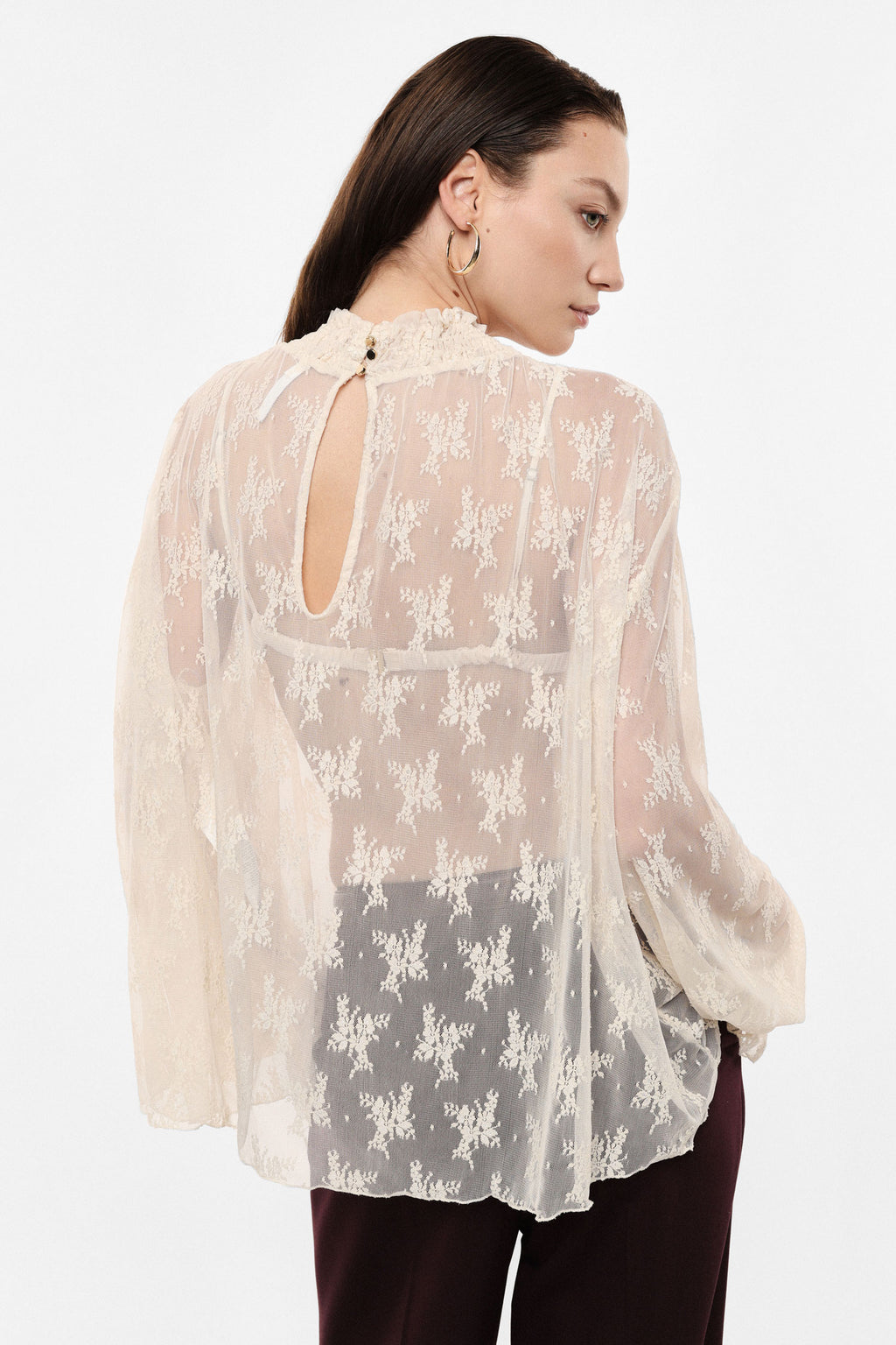 Top con maniche lunghe in tulle stampato