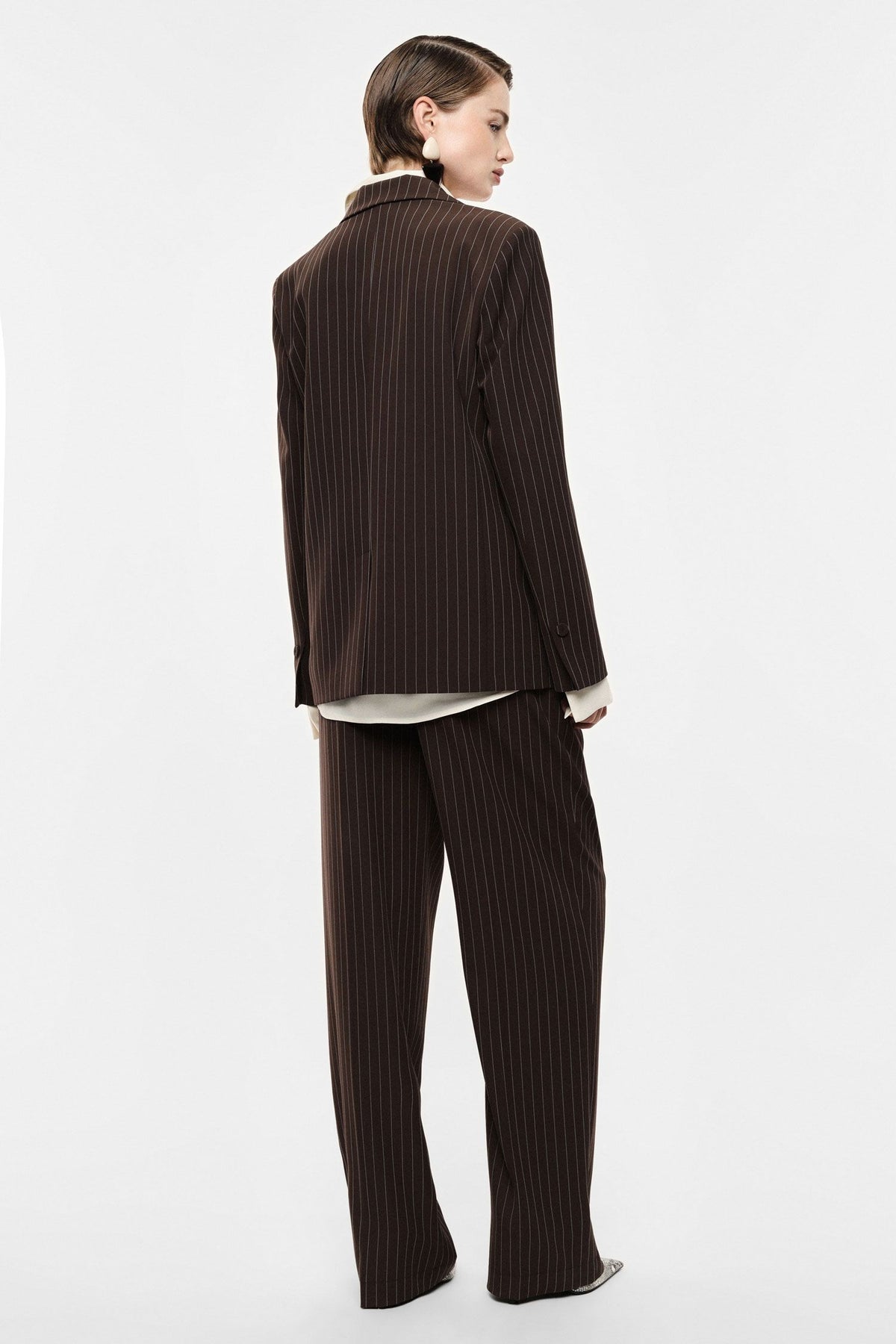 Pantaloni palazzo a righe con cintura fiore