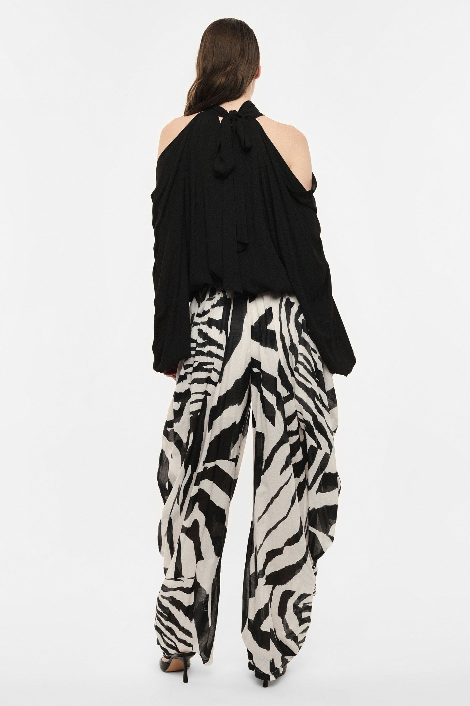 Pantaloni palazzo con stampa e drappeggio