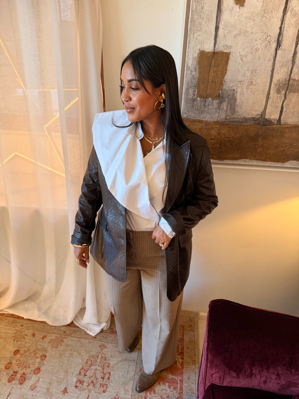 Blusa asimmetrica con maniche lunghe e nodo laterale